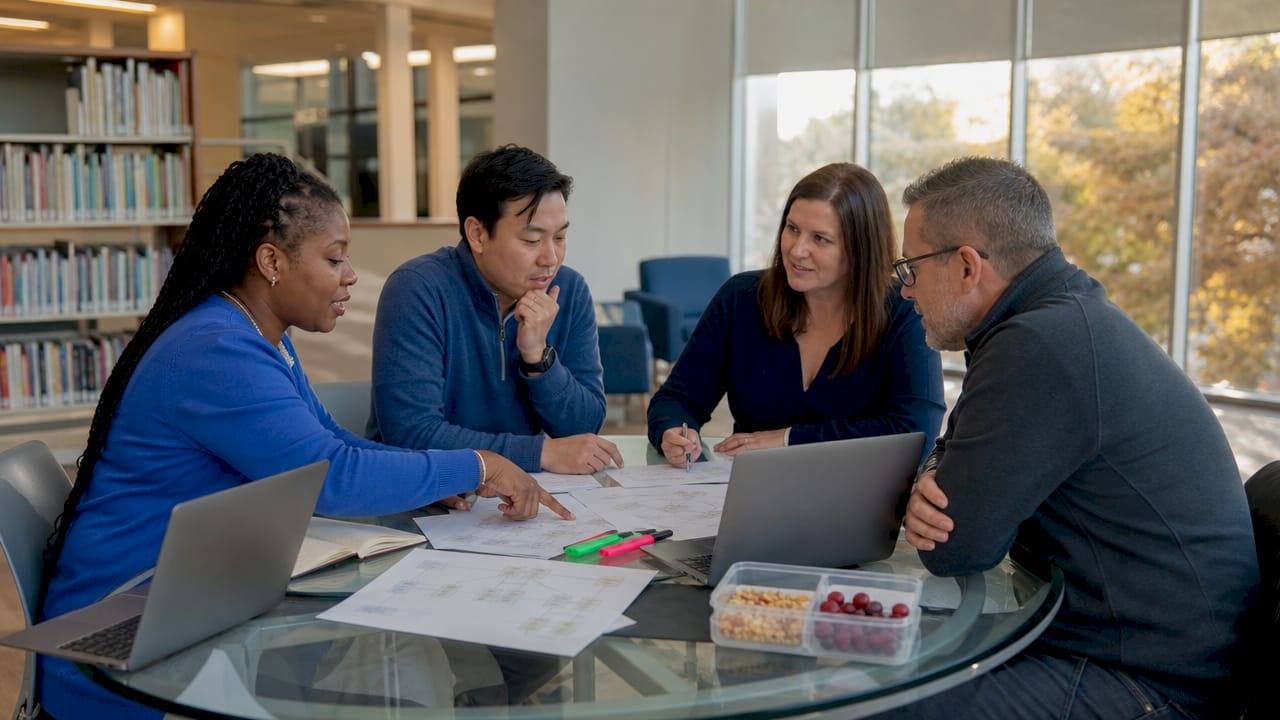 School staff planning website layout together